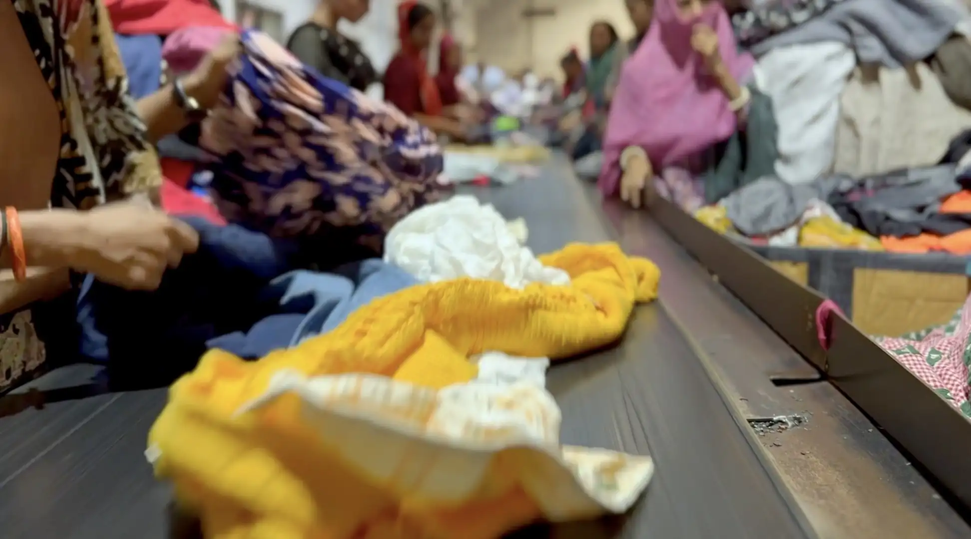 Used Clothing Recycled clothing on conveyor belt